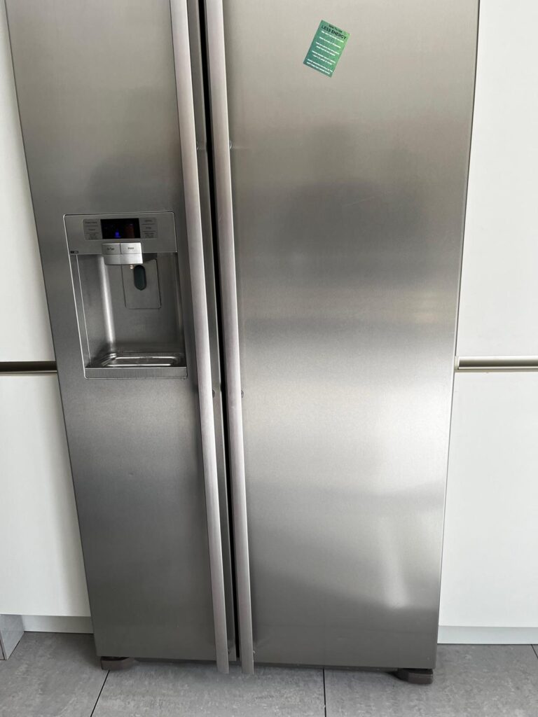Stainless steel American-style fridge freezer after professional kitchen cleaning, with polished exterior and fingerprint-free finish.